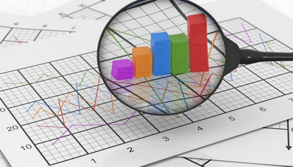 Decorative image of a magnifying glass over a spreadsheet with multicolored lines of data.